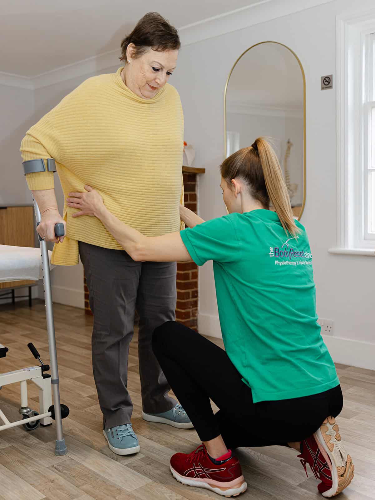 Tasymin Jackson assessing a client to create a tailored physiotherapy plan