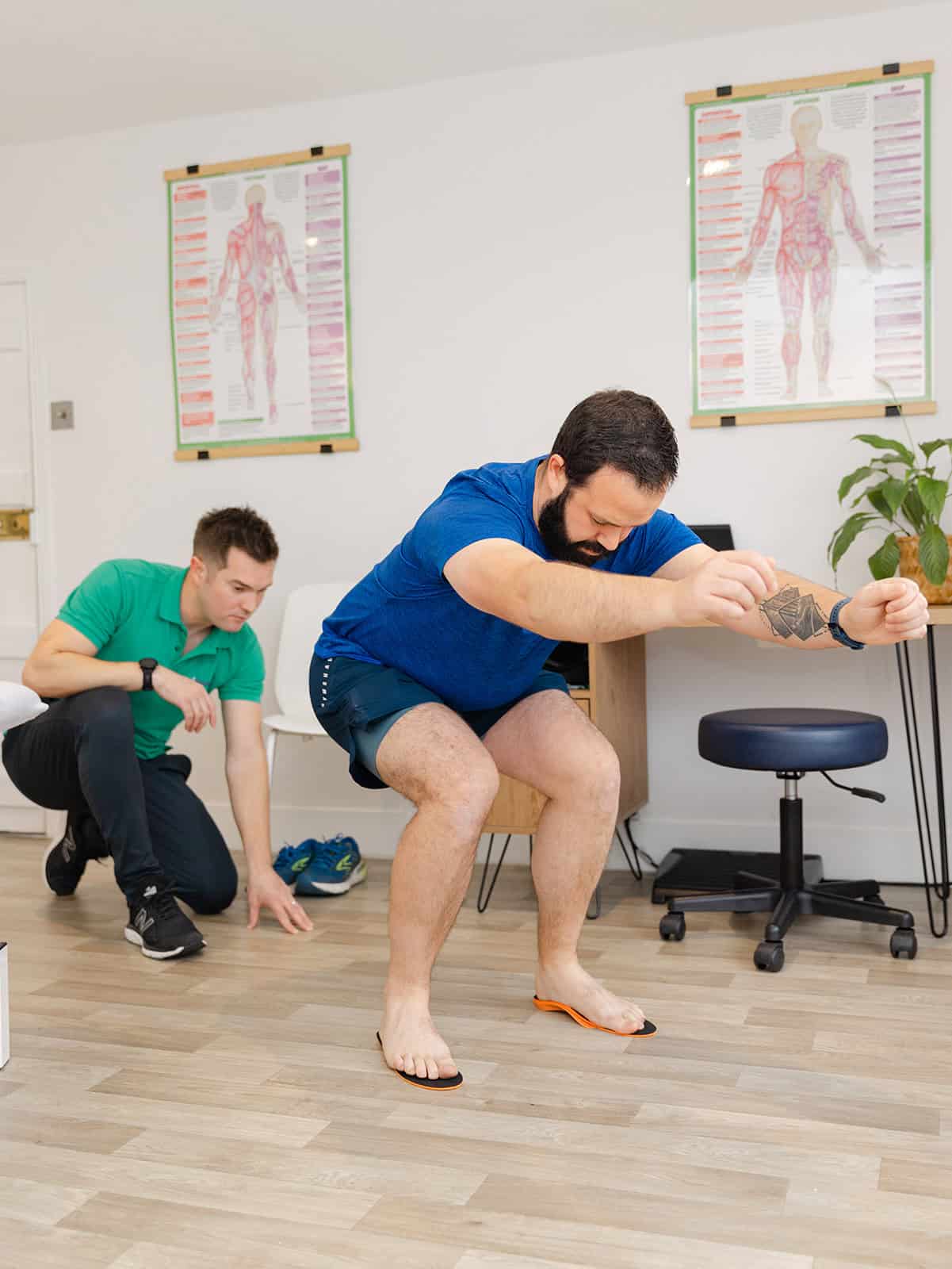 Adam Harrison working to improve client’s foot alignment and posture using custom orthotics 